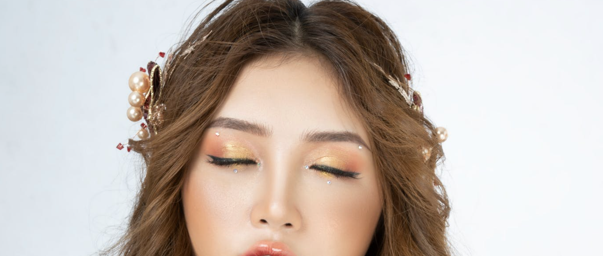 Step away from the clumpy mascara and step into a world of lash magic with eyelash embellishments!